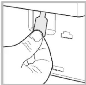 Hand inserting a USB into a device (no text or symbols visible)