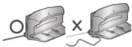 Two mechanical components with a circular symbol and an 'X' mark, connected by a string (no text or symbols present)