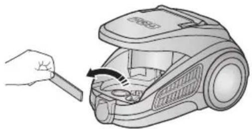 Illustration of a hand using a tool to adjust or install a vacuum cleaner's air gap (no text or symbols present).