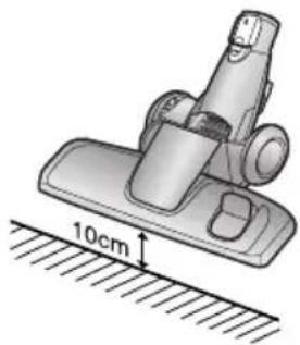 Mechanical device with a 10 cm measurement annotation on a surface (no text or symbols beyond the scale indicator).