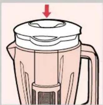 Illustration of a blender with a red arrow indicating downward motion (no text or symbols)