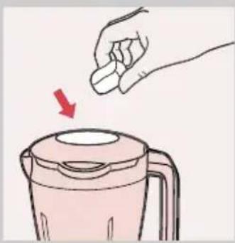 Illustration of a hand pressing down on a pink blender with a red arrow indicating compression (no text or symbols)
