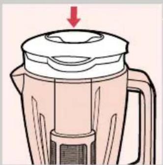 Illustration of a blender with a red arrow indicating downward motion (no text or symbols)