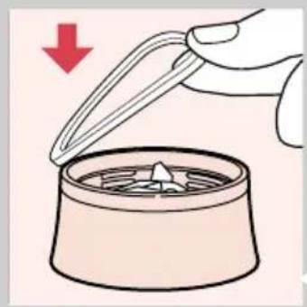 Illustration of a hand using a pipette to remove a cup into a container with a star-shaped lid (no text or symbols)