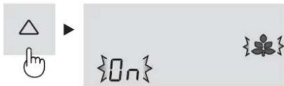 Diagram showing a hand cursor pointing to a triangle icon, next to a bracket labeled {On} and a small leaf symbol.
