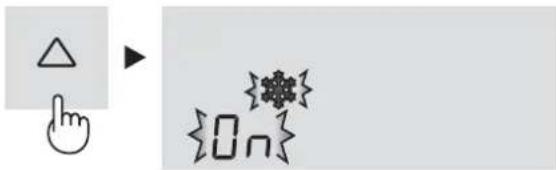Diagram showing a hand cursor pointing at a triangle and a snowflake symbol with the text {On} below it.