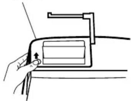 Line drawing of a hand pressing a button on a device component (no text or symbols).