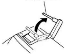 Diagram of a mechanical device with an arrow indicating rotation or movement (no text or symbols present).