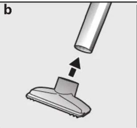 Diagram showing a vacuum cleaner being inserted into a component, with no visible text or symbols