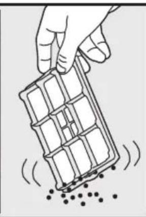 Hand holding a grid-like object with scattered dots, no text or symbols visible