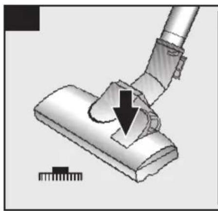 Diagram of a vacuum cleaner with a downward arrow indicating motion, no text or symbols present