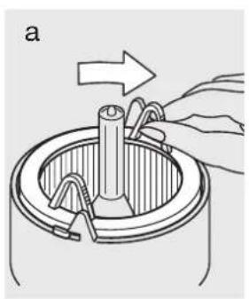Diagram of a mechanical component with a hand holding a tool, showing a rotating shaft and clamping mechanism (no text or symbols)