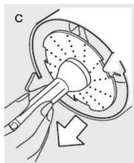 Diagram of a medical procedure showing a tool interacting with a circular device (no text or symbols present)