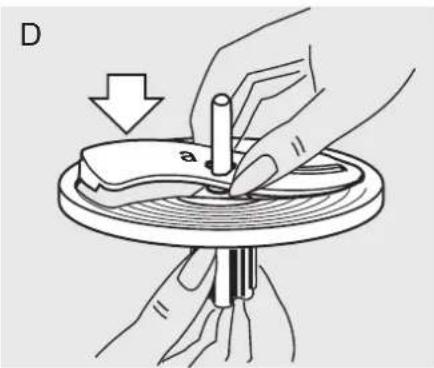 Illustration of hands using a tool to adjust or install a mechanical component, with no visible text or symbols.