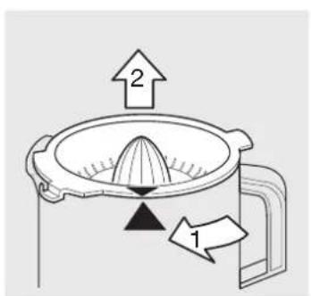 Diagram showing a grater with labeled parts and directional arrows indicating process flow