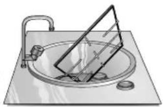 Simple line drawing of a sink with a triangular object on top.