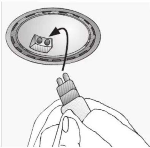 Illustration of a hand holding a cable with a magnified inset showing a device inside a circular frame (no text or symbols)