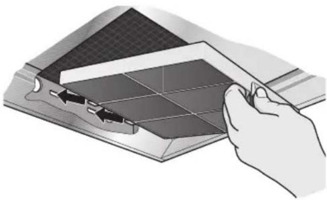 Illustration of a hand using a tool to cut or mark a grid-patterned object on a surface (no text or symbols visible)