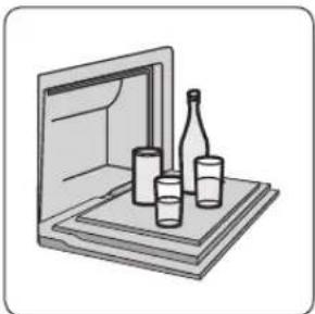 Illustration of a closed book with three small items on top (no text or symbols)