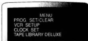 MENU PROG SET/CLEAR VCR SETUP CLOCK SET TAPE LIBRARY DELUXE