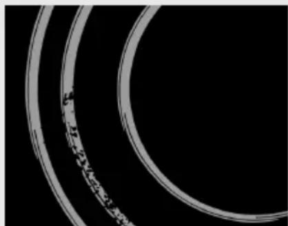 Close-up of two concentric circular rings with a textured inner ring, no visible text or symbols