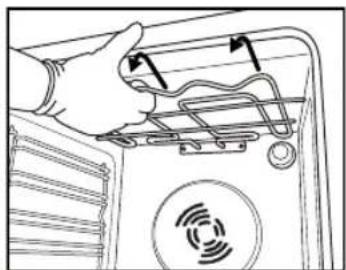 Illustration of a hand inserting a spring into a device panel with a circular sensor icon (no text or symbols).