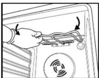 Hand inserting cables into a device panel with a circular icon showing signal waves (no text or symbols)