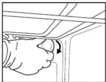 Line drawing of a hand inserting a valve into a wall, showing the handle and arrow (no text or symbols)