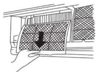 Hand placing a down arrow on a grid-patterned air conditioner cover (no text or symbols visible)