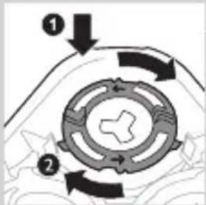 Diagram showing a circular mechanical or fluid system with labeled components and directional arrows indicating flow or movement.