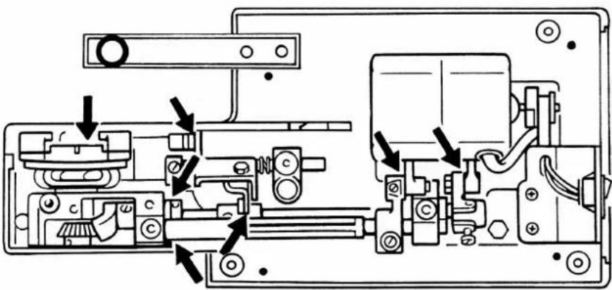 Technical diagram of a mechanical assembly with labeled components and directional arrows indicating assembly or movement.
