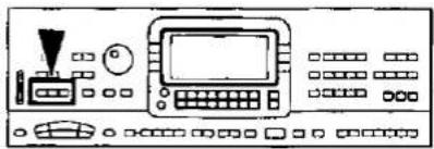 Front view of a control panel with buttons, display screen, and control knobs (no text or symbols visible)