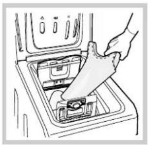 Line drawing of a hand inserting a plastic bag into an open appliance (no text or symbols).