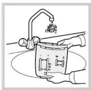 Line drawing of a hand using a tool to clean or wash a small container (no text or symbols visible).