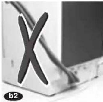 Close-up of a computer monitor with a large 'X' symbol on its screen (no readable text or symbols).