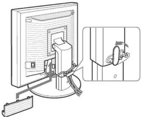 Diagram of a computer monitor with cable and connector, showing a close-up view of the door handle (no text or symbols present)