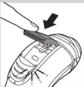 Diagram of a mechanical component with a tool inserted, showing internal parts and a downward arrow indicating direction (no text or symbols present)