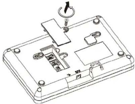 Technical line drawing of a device casing with internal components and a dial indicator (no text or symbols)