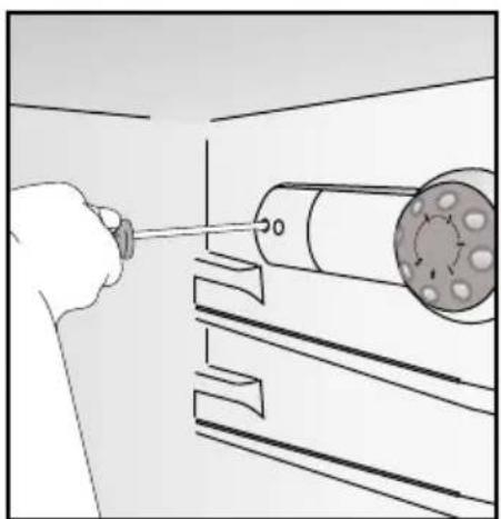 Illustration of a hand using a tool to measure a cylindrical object on a workbench.