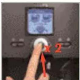 Photo of a computer monitor with two buttons labeled 'x' and '2', showing a finger pointing to the button.