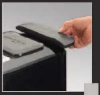 Hand inserting a card into a device (no visible text or symbols).