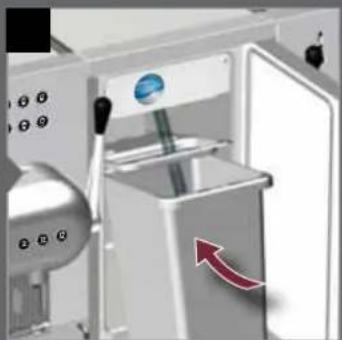 Interior view of a stainless steel industrial machine with a blue sphere and red directional arrow indicating flow or movement (no text or symbols visible)