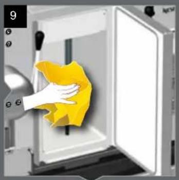 Person cleaning a kitchen appliance with a yellow cloth (no text or symbols visible)