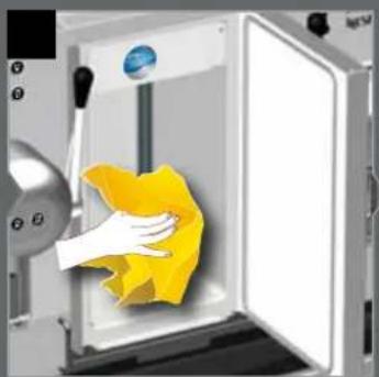 Illustration of a hand cleaning a yellow cloth inside a white oven (no text or symbols visible)