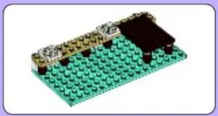 Green LEGO base with black and gold components, no visible text or symbols
