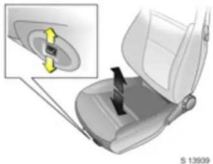 Car seat assembly diagram showing a key inserted into the seat, with an inset highlighting the internal components (no text or symbols present)
