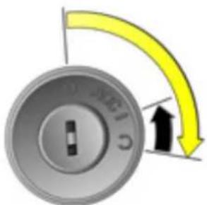 Close-up of a rotary knob with a yellow curved arrow indicating clockwise motion (no text or symbols)