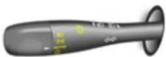 Close-up of a black pen-like object with green markings, no visible text or symbols