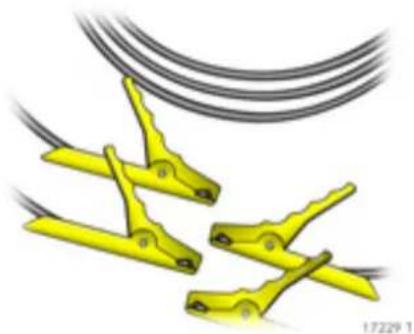 Three yellow clamping clips attached to a black cable, no text or symbols visible