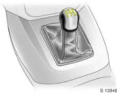 Close-up illustration of a mechanical gear switch with a yellow hammer on top (no text or symbols visible)
